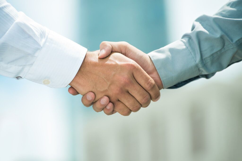 Two People Shaking Hands